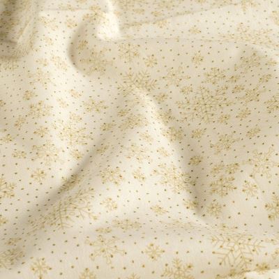Christmas fabric made of cotton in cream color with a print of golden snowflakes 60554/051 Christmas fabric made of cotton in cream color with a print of golden snowflakes 60554/051