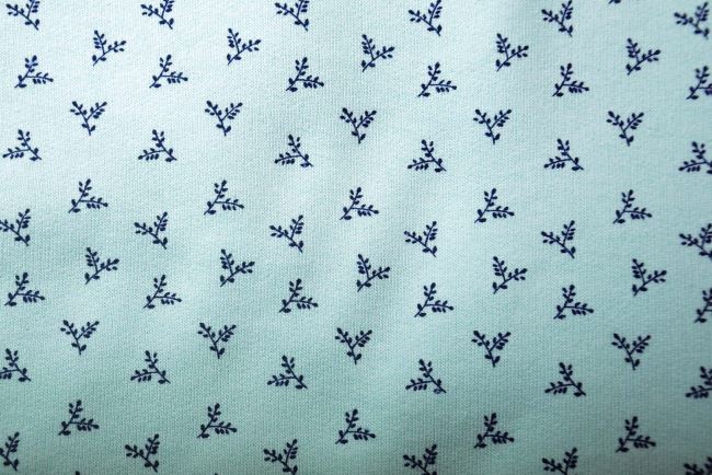1 m combed tracksuit in menthol color with a print of twigs with leaves DS-KUP137