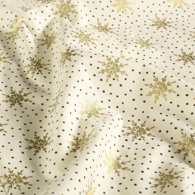Christmas fabric made of cotton in cream color with a print of golden snowflakes 60679/051