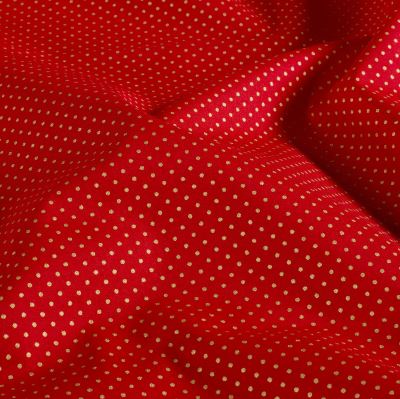Christmas cotton fabric in red with a print of small golden dots 60893/055 Christmas cotton fabric in red with a print of small golden dots 60893/055