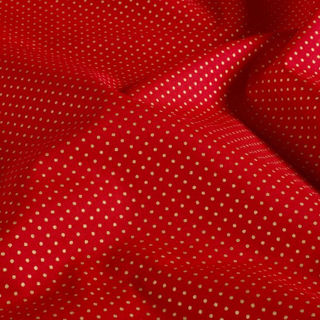 Christmas cotton fabric in red with a print of small golden dots 60893/055