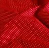 Christmas cotton fabric in red with a print of small golden dots 60893/055
