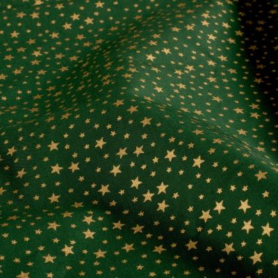 Christmas cotton fabric in green with gold star print 60895/236 Christmas cotton fabric in green with gold star print 60895/236