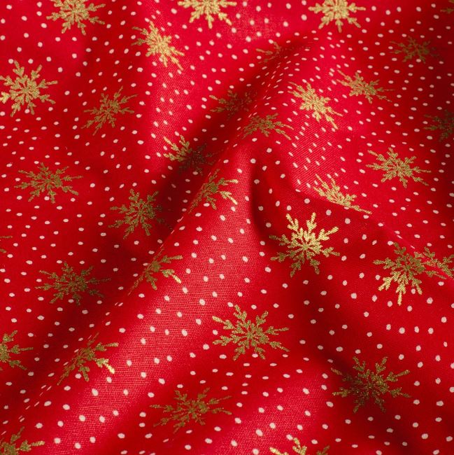 Christmas cotton fabric in red with a print of golden snowflakes 60679/015