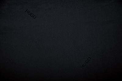 Polyester lining in black with a woven HUGO BOSS PO19 lettering pattern