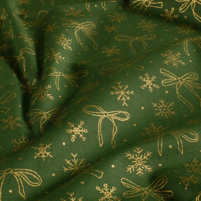 Christmas cotton fabric in green with a print of golden snowflakes 60542/027