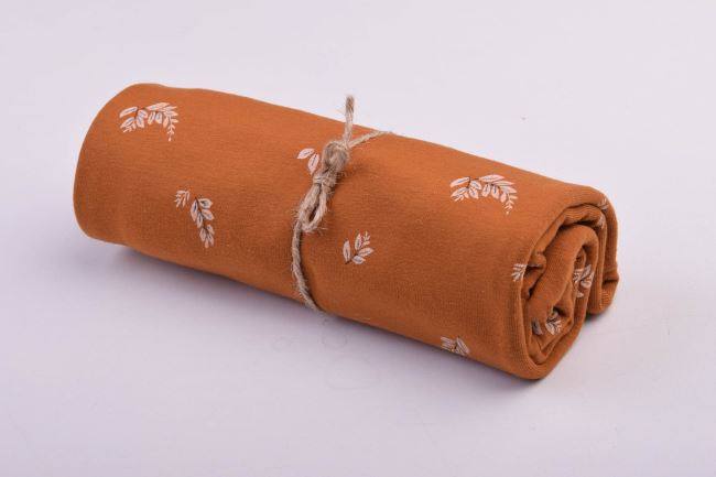 Roll of cotton knit in ocher color with leaf print RO18485/053