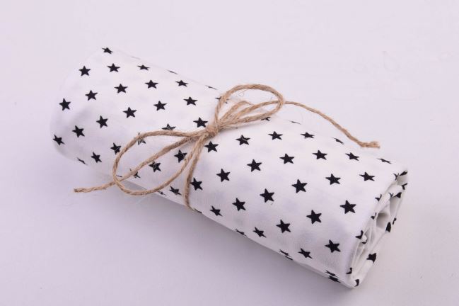 Roll of cotton knit in cream color with star print RO11802/050