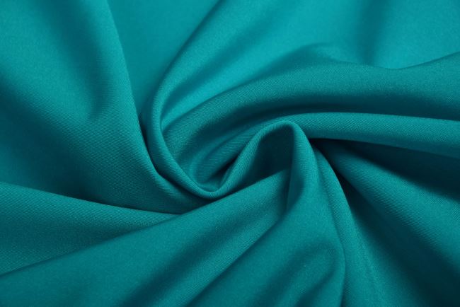 Shiny functional knitwear in turquoise color MO007109