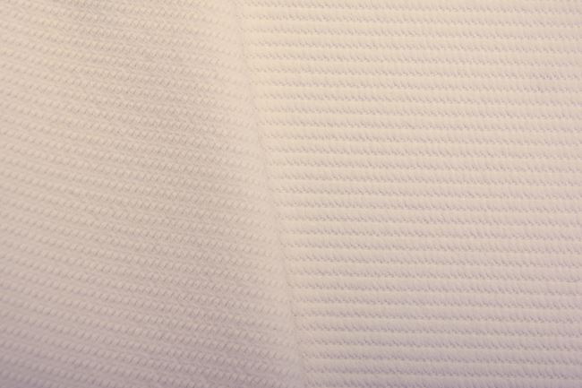 Costume fabric in cream color with plastic pattern TI584