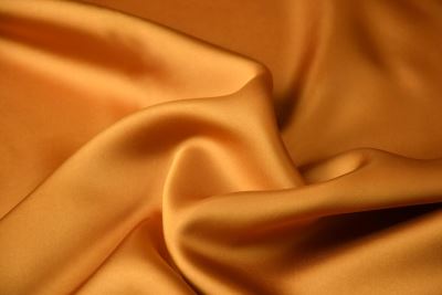 Blouse fabric/dress fabric in dark gold color with satin and cupro look Q1015