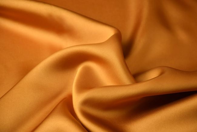 Blouse/dress in dark gold color with satin look Q1015