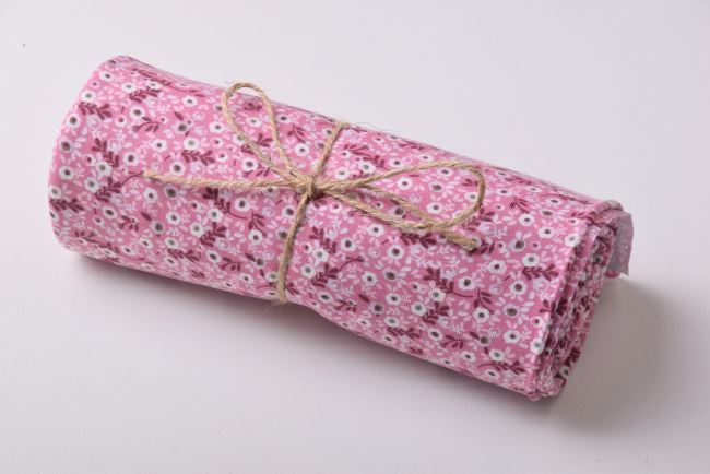 Roll of cotton knit in pink color with flower print RO19559/014