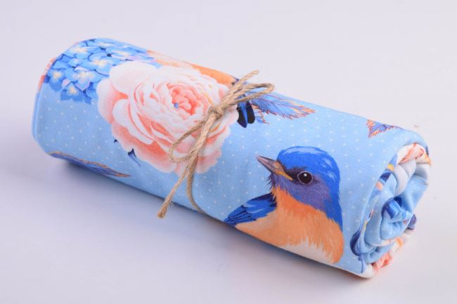 Roll of cotton knit in blue color with a print of birds and flowers RO62327