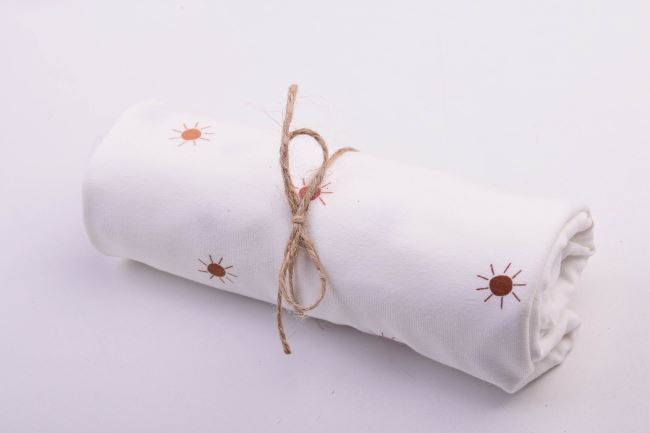 Roll of cotton knit in cream color with sun print RO18471/051