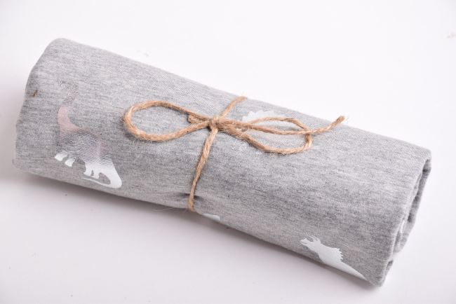 Roll of cotton knit in gray melange with dinosaur foil print RO18165/063