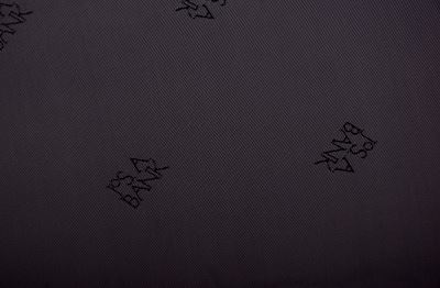Polyester lining in gray-brown color with a woven pattern of the inscription PO22 Polyester lining in gray-brown color with a woven pattern of the inscription PO22