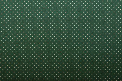 Christmas cotton fabric in green with a print of small gold dots 60893/056