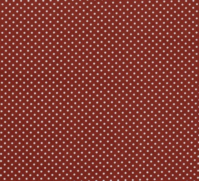 Cotton fabric in brick color with a print of small dots 05575/056