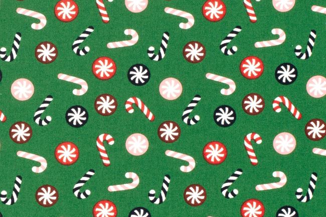 Christmas fabric made of cotton in green color with thematic print 22734/025